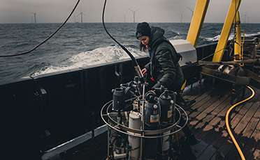 a woman conducting measurements at the ship