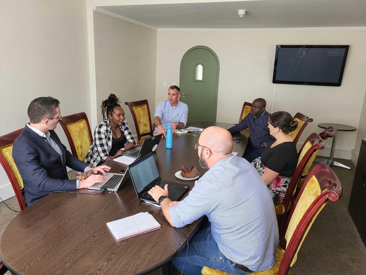 people gathered around a table for a discussion at the KADI project kick-off