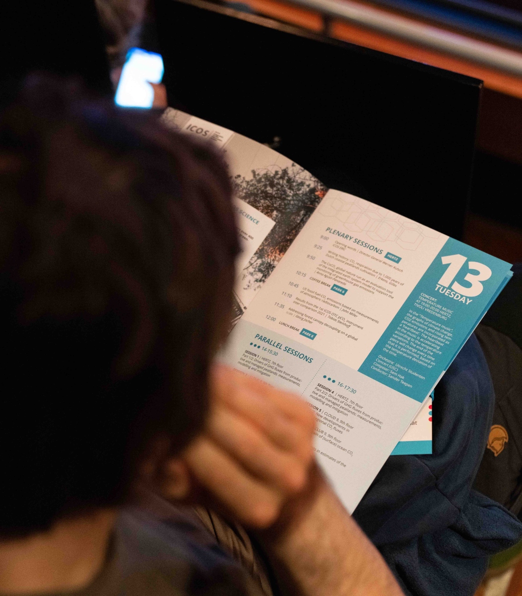 Conference attendee peruses the programme