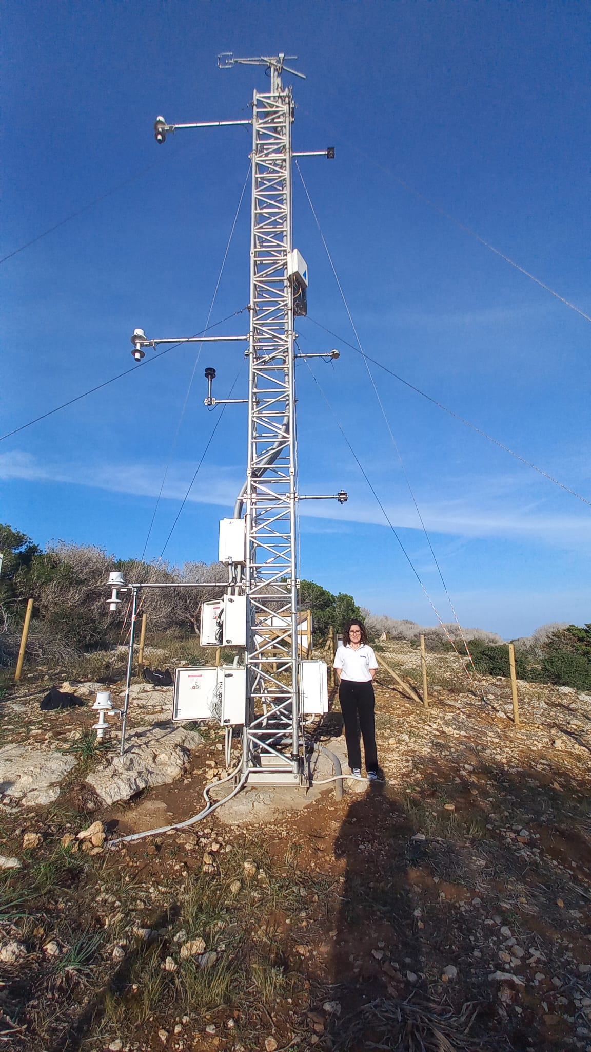station PI Daniela Meloni standing next to the measurement tower