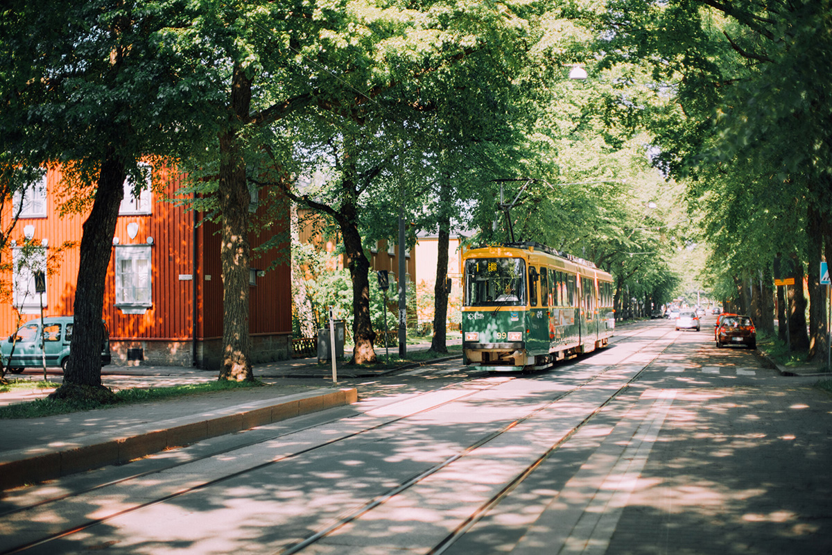tram travelling on a green pathway