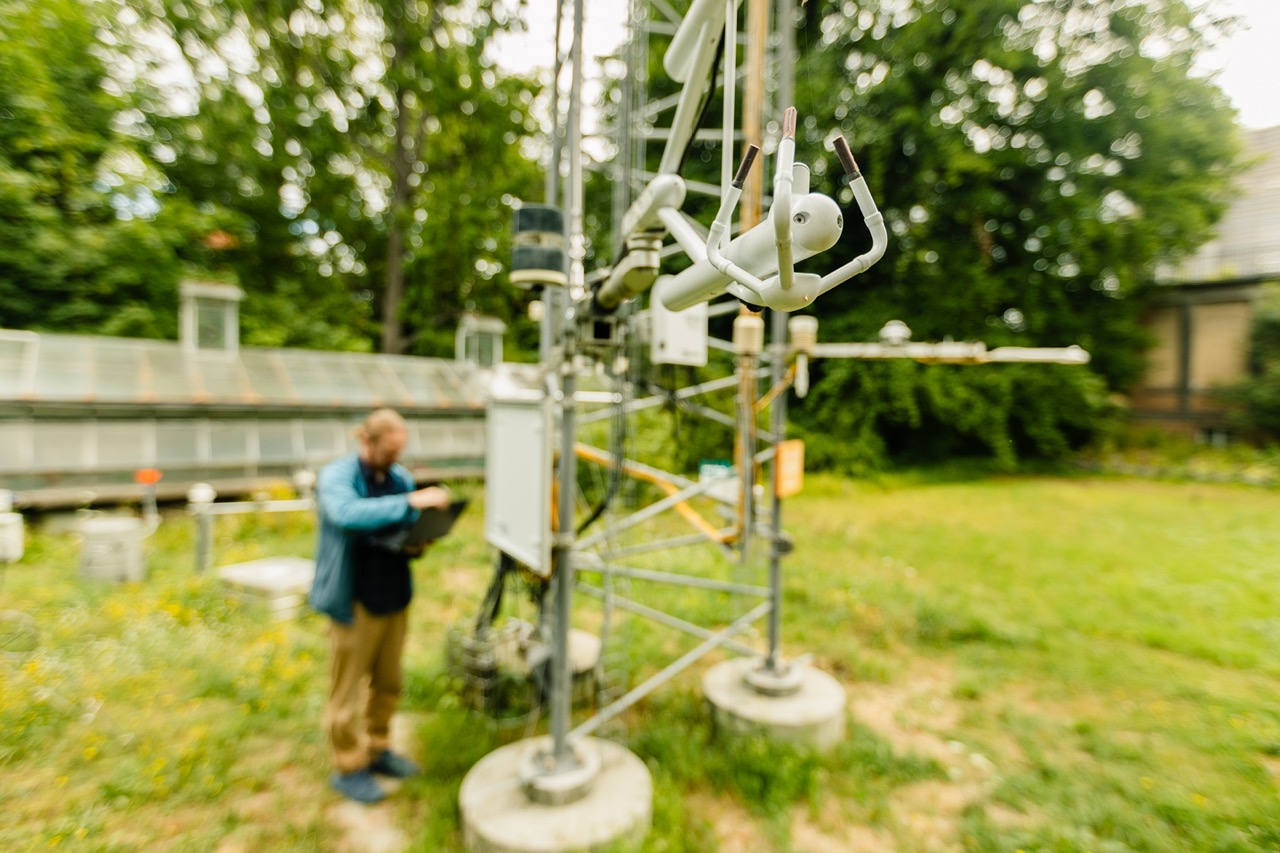 Closeup of the eddy covariance instrument with the station PI Fred Meier in the back