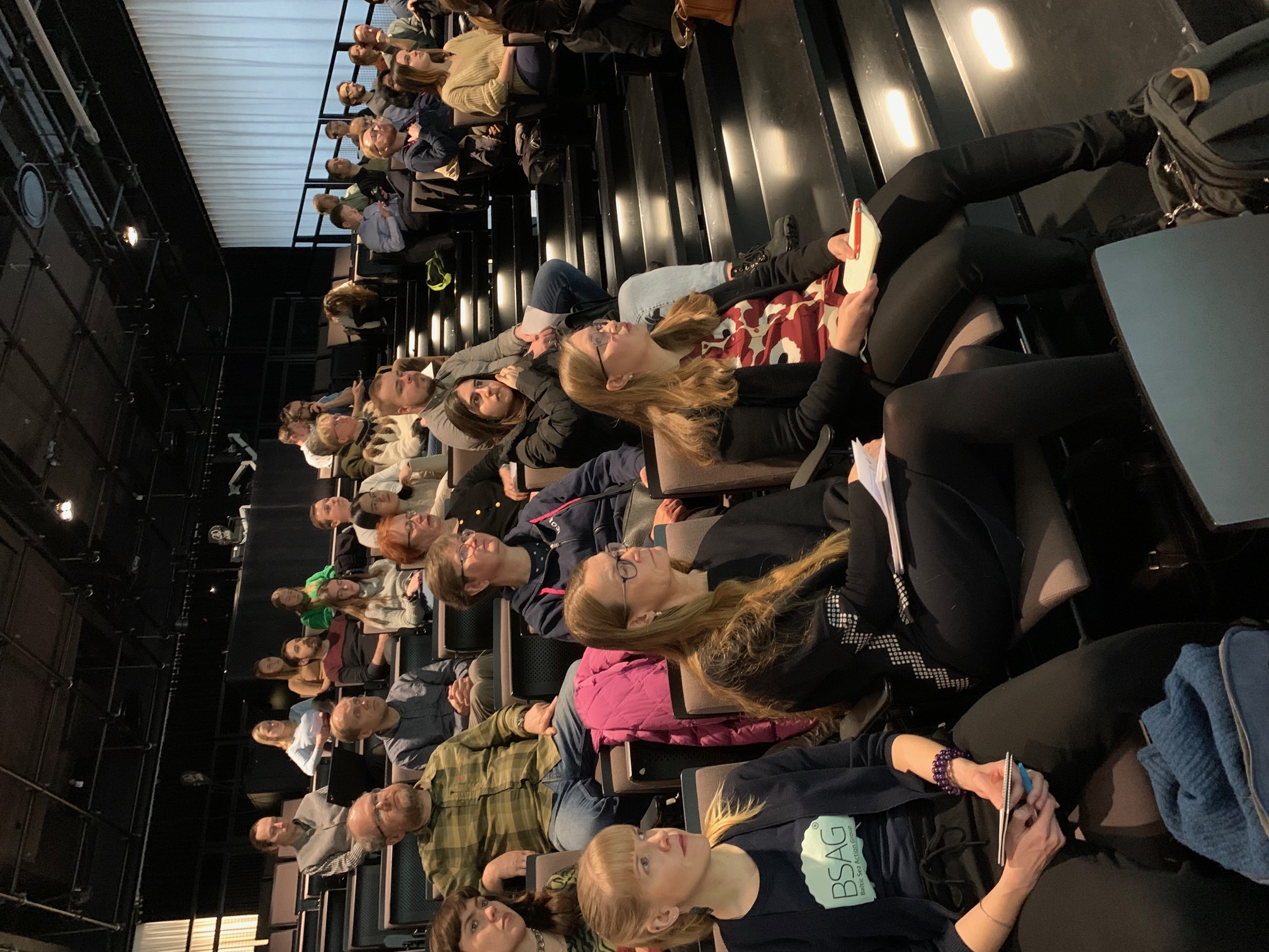 Audience members listening to presentations on Geoscience Day