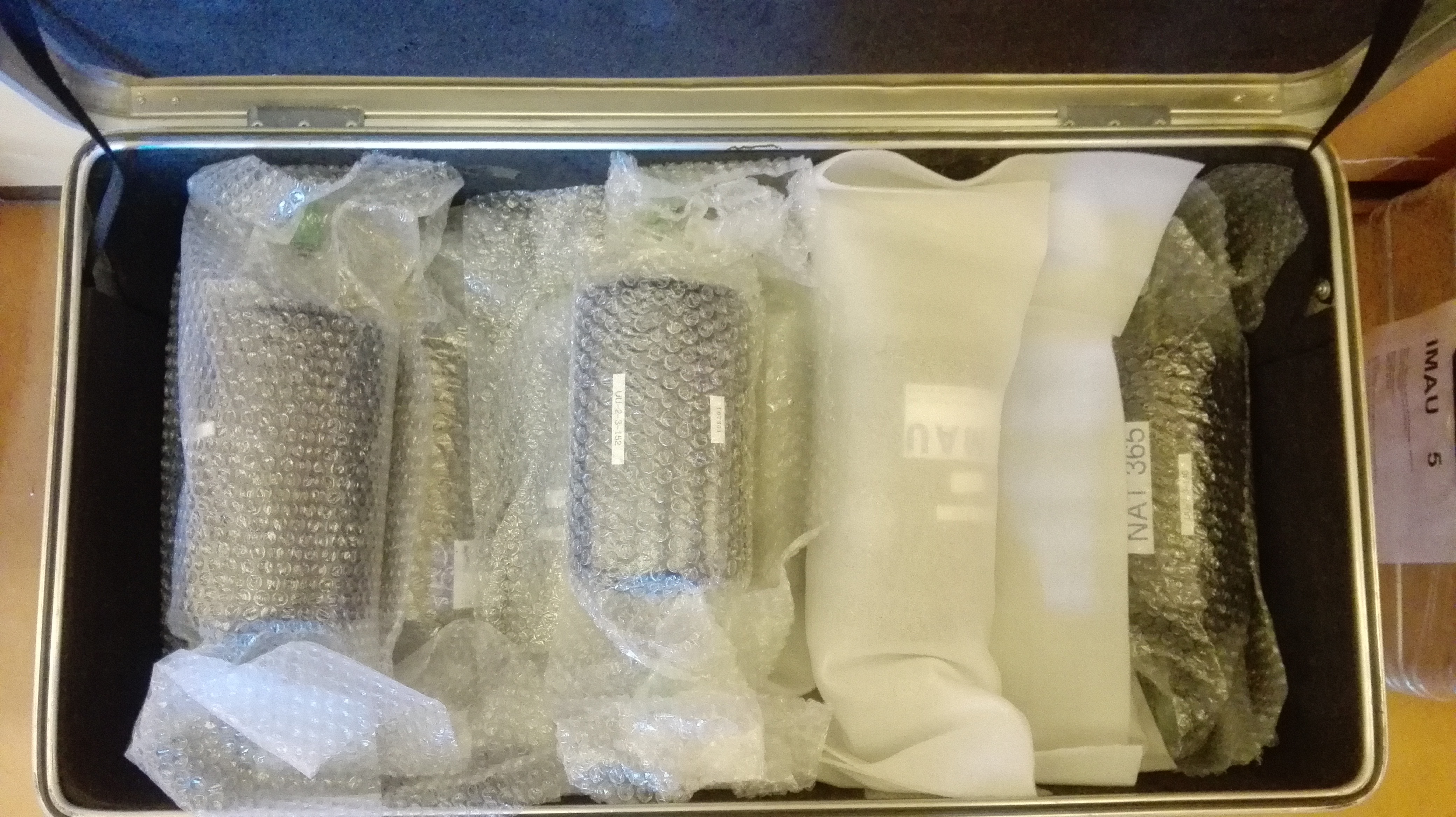 Figure 4) Flasks filled with air samples collected at the ICOS site in a suitcase. Photo taken by Gerbrand Koren