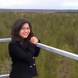 Aki Tsuruta overlooking forest from the ICOS measurement station in Pallas-Sammaltunturi.