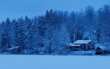 Impression of the ICOS Winter School at Hyytiäla. Viewed are the two sauna buildings at the lakeside