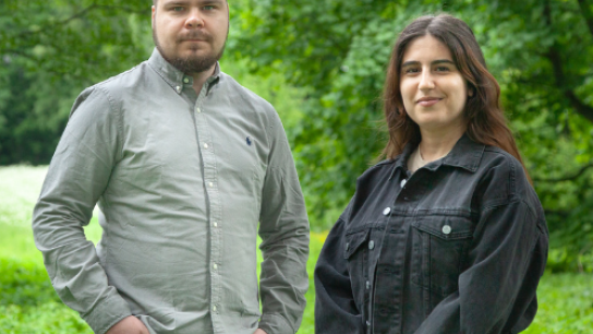Picture of Emilie Hachem and Tommi Pesonen in a green landscape 