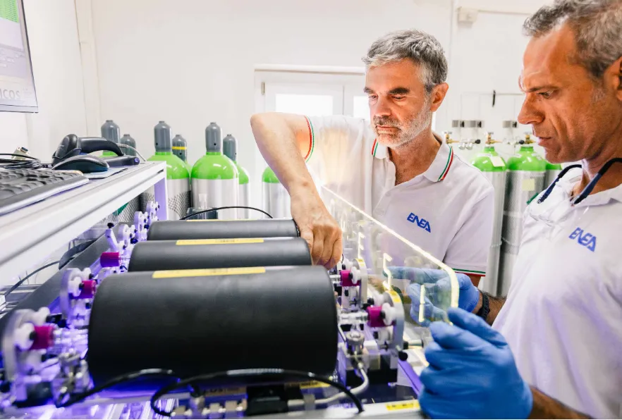 Scientists with a flask sampler