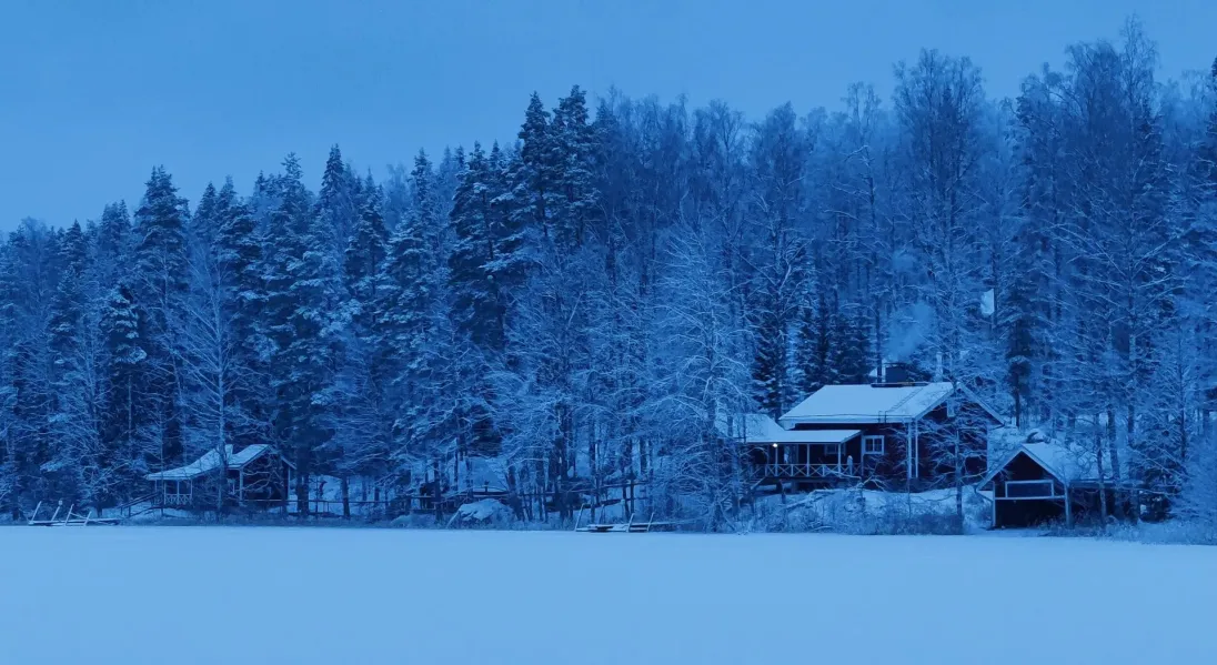 Impression of the ICOS Winter School at Hyytiäla. Viewed are the two sauna buildings at the lakeside